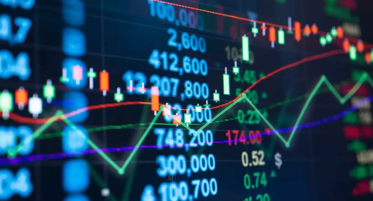 Grafico di borsa con candele e numeri che mostrano l'andamento dei titoli